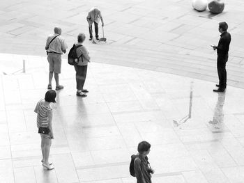 Full length of boy playing with arms raised