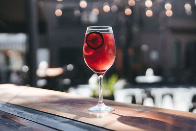 Close-up of wineglass on table