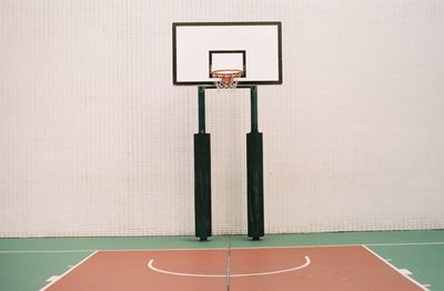 Basketball hoop against wall