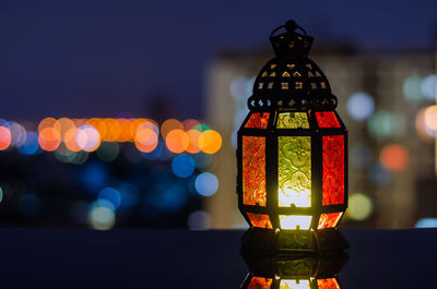 Lantern with apartment building background for the muslim feast of the holy month of ramadan kareem.