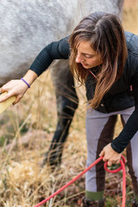 Side view of woman working at farm