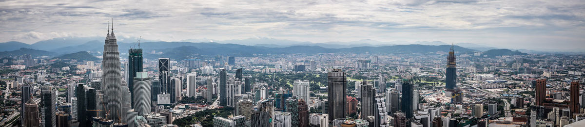 Panoramic view of cityscape against sky