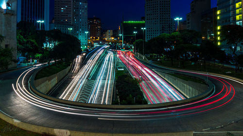 High angle view of light trails on highway at night