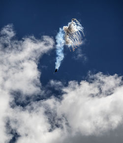 Low angle view of airshow against sky