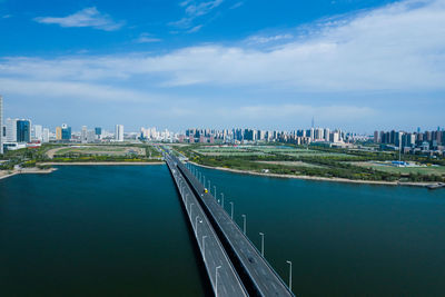 Panoramic view of river and buildings against sky