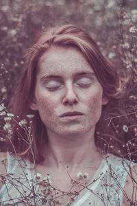 Close-up of young woman with eyes closed