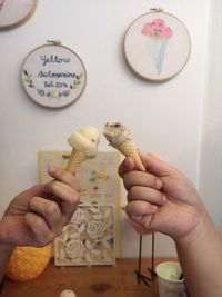 Midsection of person holding food on table