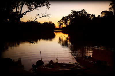 Scenic view of lake at sunset