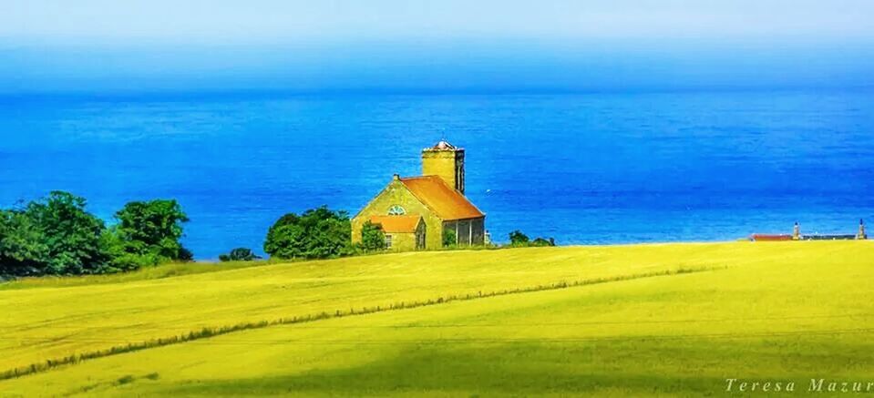 VIEW OF LIGHTHOUSE AGAINST BLUE SKY