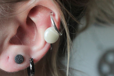 Cropped image of woman wearing earrings