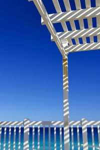 Low angle view of built structure against clear blue sky