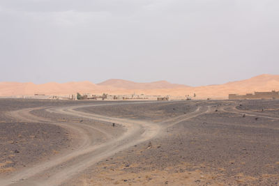 Country road leading towards mountains