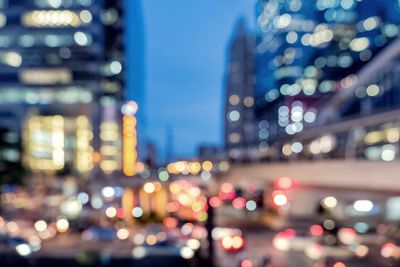 Defocused image of illuminated city at night