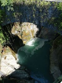 High angle view of rocks by sea