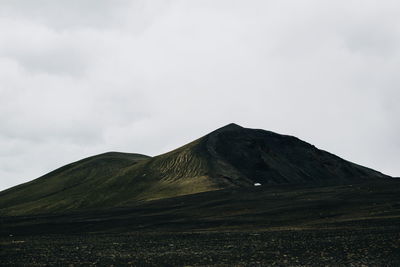 Scenic view of volcanic mountain against sky