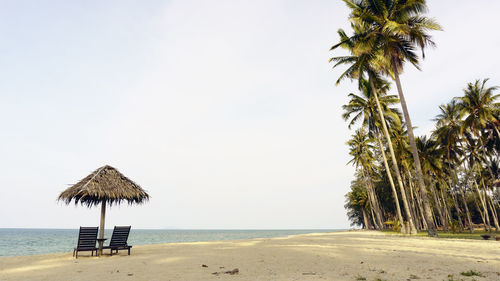 Beach against clear sky