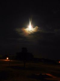 Scenic view of landscape against sky at night