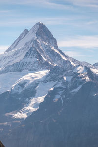 Scenic view of snowcapped mountain against sky