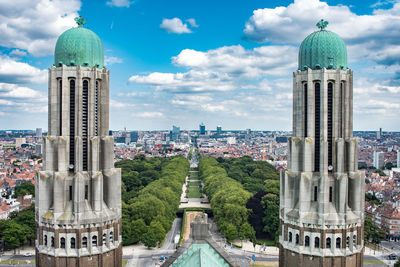 Panoramic view of buildings in city against sky