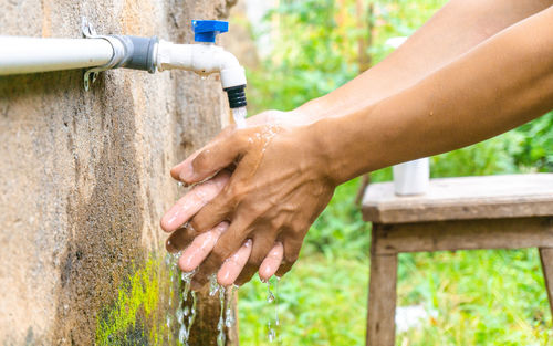 Close-up of woman hand holding water pipe