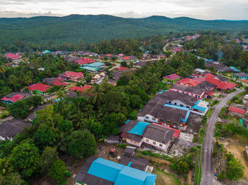 High angle view of trees and buildings against sky