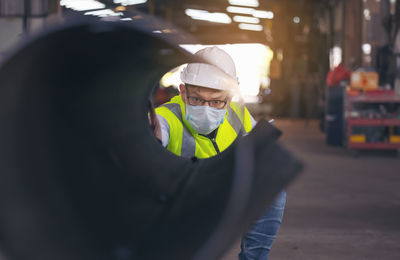 Engineers examine new coated pipe in factory, ventory check