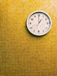 Close-up of clock on wall