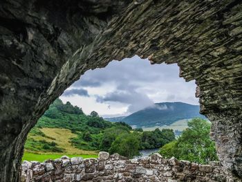 Urquhart castle - scenic view of mountains against sky