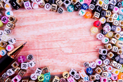 Directly above shot of pen and letters on table