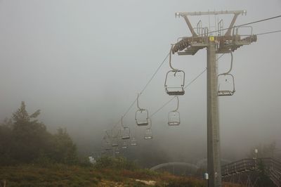 Overhead cable cars in foggy weather