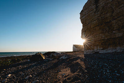 Scenic view of sea against clear sky during sunset