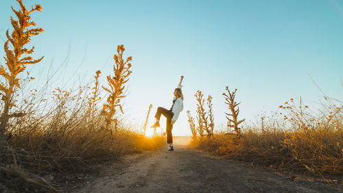 Man on field against clear sky