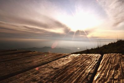 Scenic view of land against sky during sunset