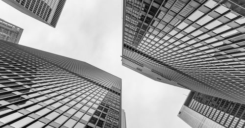 Low angle view of tall buildings against sky