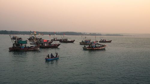 Boats and fishermen sunset time vengurla beach 