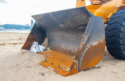 Close-up of abandoned boat on beach