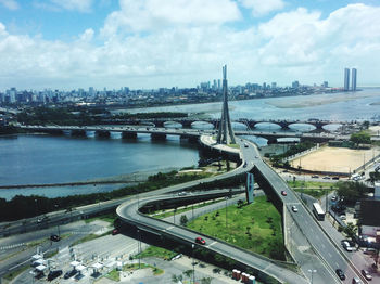 High angle view of bridge over river in city against sky