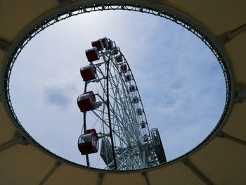 Low angle view of ferris wheel against sky