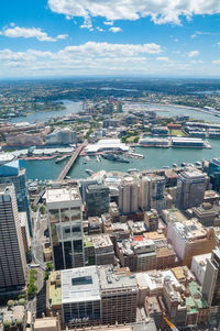 High angle view of river amidst buildings in city against sky