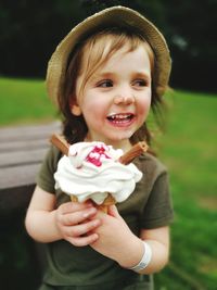 Portrait of smiling girl holding ice cream