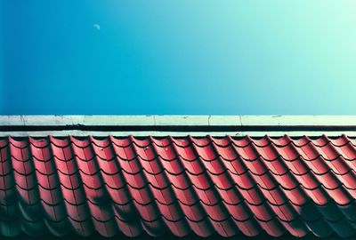 Low angle view of roof against clear blue sky