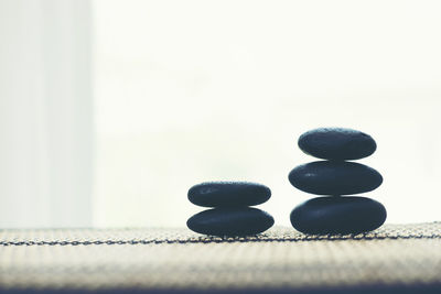 Close-up of stacked pebbles on table