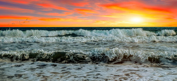 Scenic view of sea against sky during sunset