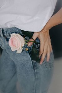 Close-up of hand holding rose bouquet