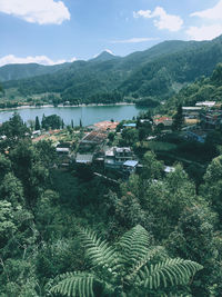 High angle view of trees and mountains against sky