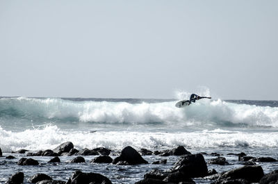 Sea waves splashing on rocks