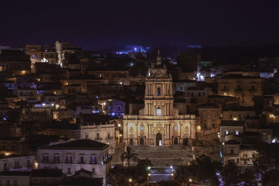 Illuminated buildings in city at night