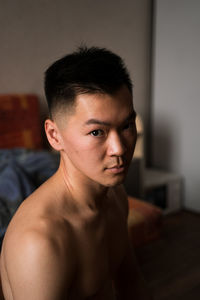 Portrait of shirtless man at home