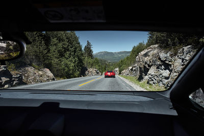 Road seen through car windshield