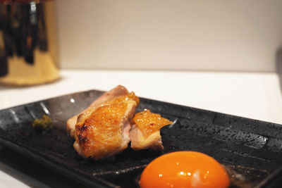 Close-up of meat in plate on table